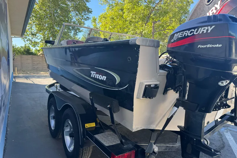 Slide: The Image of 2005 Triton DV 186 Mag boat with Mercury FourStroke engine on trailer. - 3