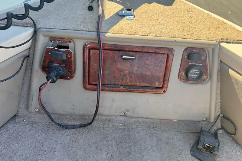 Slide: The Image of Control panel of a 2005 Triton DV 186 Mag boat with motor tilt and battery indicators. - 10