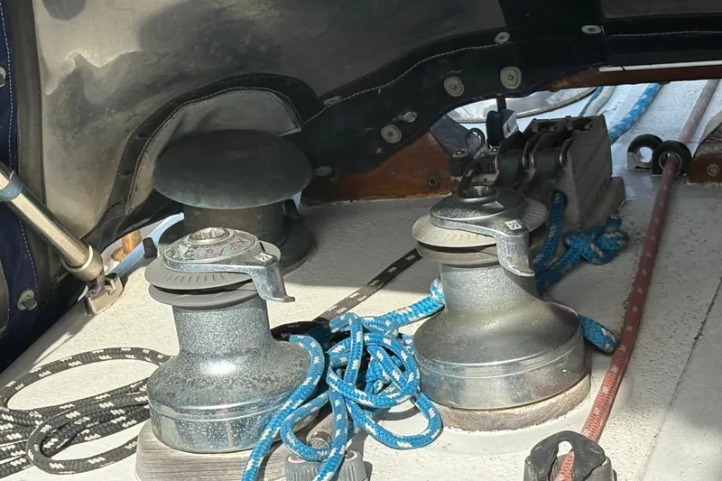 Slide: The Image of Deck equipment on a 1977 Tayana 37 Cutter sailboat with ropes and winches. - 16
