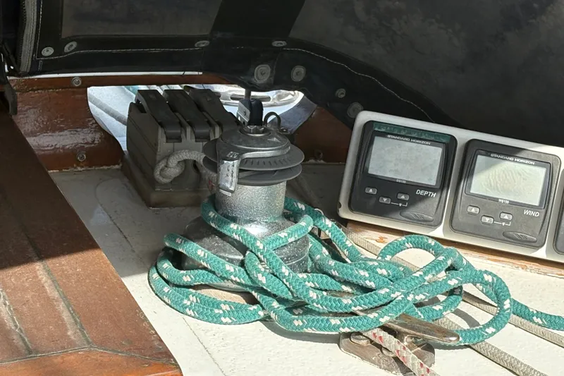Slide: The Image of Winch and instruments on 1977 Tayana 37 Cutter sailboat deck. - 17