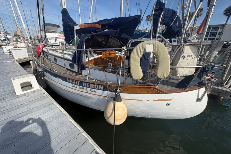 The Image of 1977 Tayana 37 Cutter sailboat docked, named "Night Heron," in Del Mar, CA marina. - 2
