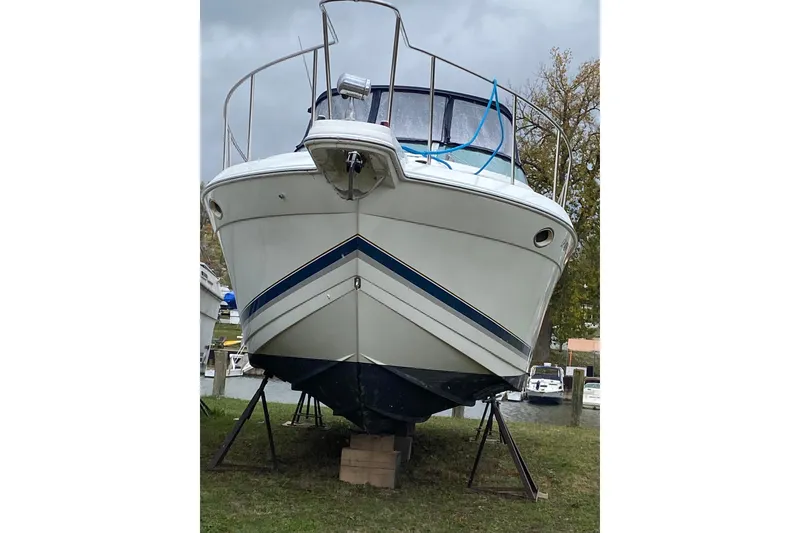 Slide: The Image of 1999 Formula 31 Performance Cruiser on stands, front view, outdoors. - 7