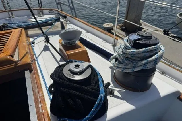 Slide: The Image of Deck of 1977 Kelly Peterson 44 sailboat with winches and ropes. - 5