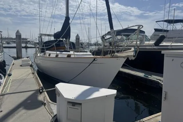 The Image of Sailboat docked at marina, Kelly Peterson 44, 1977 model, sunny day. - 0