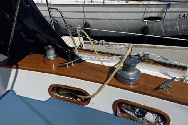 Slide: The Image of Deck of a 1977 Kelly Peterson 44 sailboat with winches and ropes. - 7