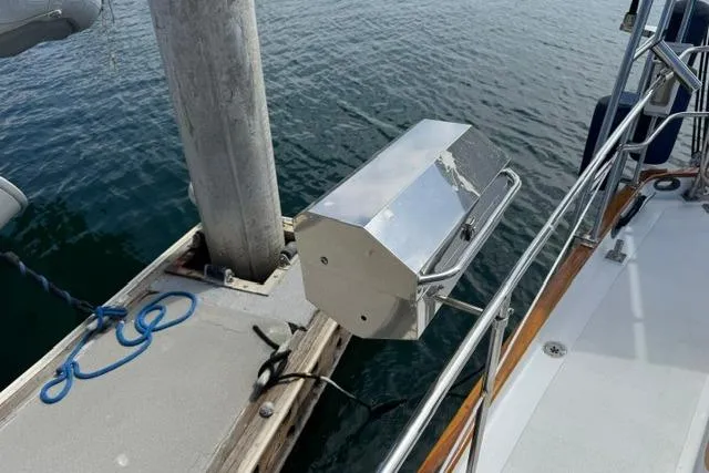 Slide: The Image of Sailboat docked with stainless steel grill, Kelly Peterson 44, 1977 model. - 36