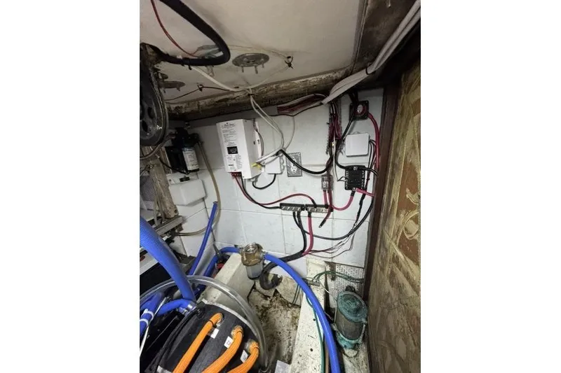 Slide: The Image of Electrical wiring and components inside a 1976 Kelly Peterson 44 sailboat. - 31