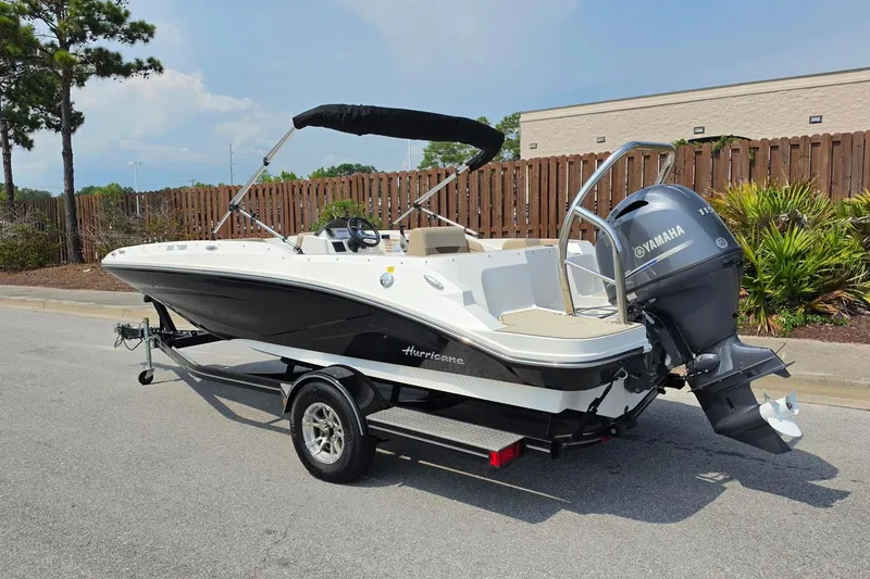 Slide: The Image of 2022 Hurricane SunDeck Sport 185 OB boat with Yamaha outboard motor on trailer. - 14