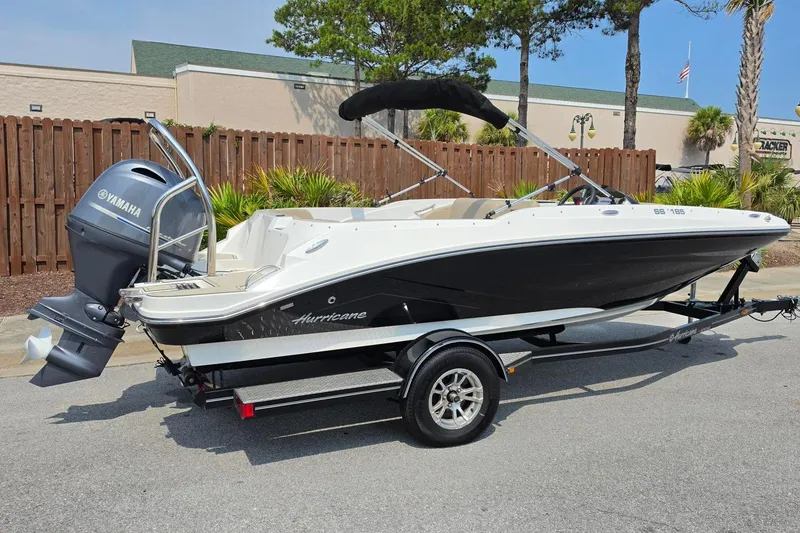 Slide: The Image of 2022 Hurricane SunDeck Sport 185 OB boat with Yamaha outboard motor on trailer. - 17