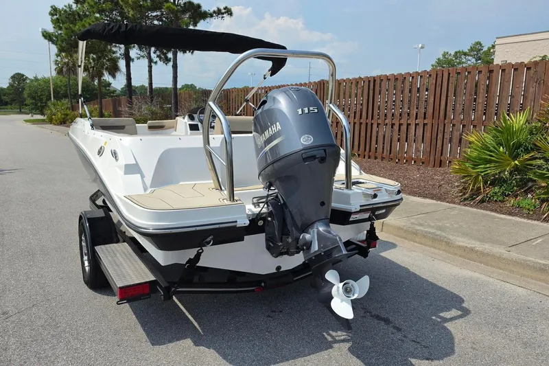 Slide: The Image of 2022 Hurricane SunDeck Sport 185 OB boat with Yamaha 115 engine on trailer. - 12