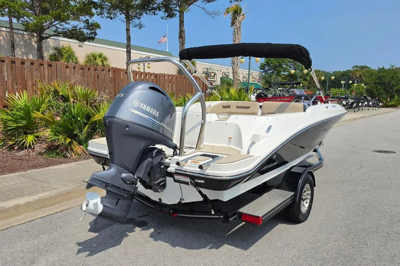 Slide: The Image of 2022 Hurricane SunDeck Sport 185 OB boat with Yamaha outboard motor on a trailer. - 3