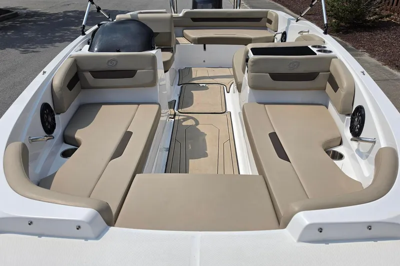 Slide: The Image of 2022 Hurricane SunDeck Sport 185 OB boat interior with beige seating and cup holders. - 4