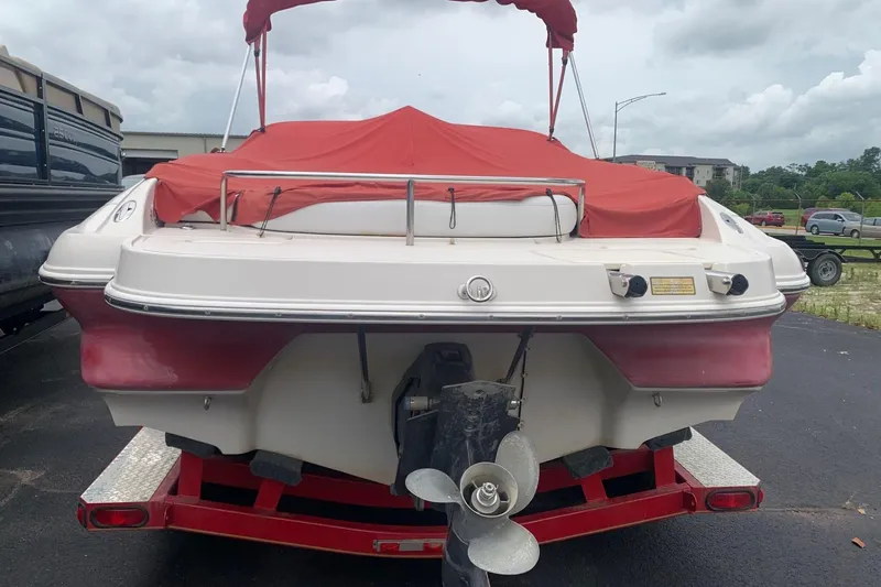 Slide: The Image of 2003 Monterey 228SI Montura Bowrider with red cover on trailer, rear view. - 8