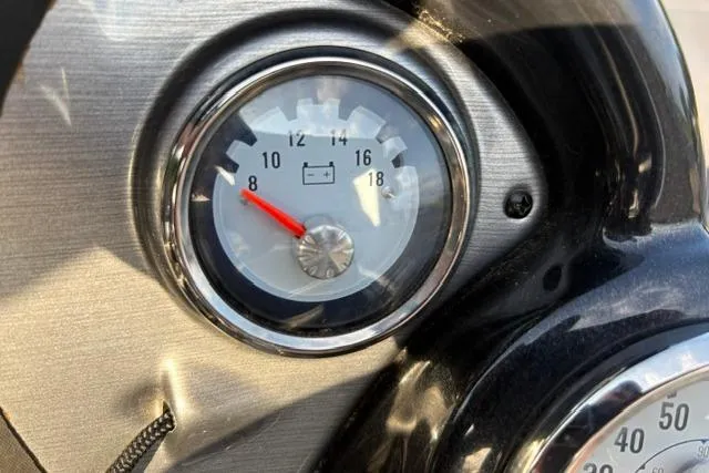 Slide: The Image of Close-up of a 2018 Tracker Pro Team 195 TXW voltmeter gauge. - 27