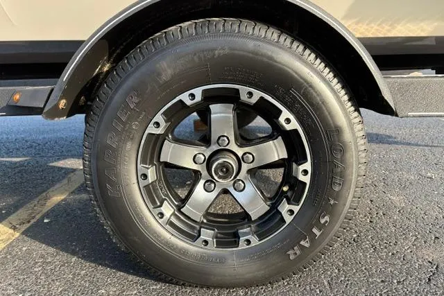 Slide: The Image of 2018 Tracker Pro Team 195 TXW wheel with Karrier Load Star tire on asphalt. - 51
