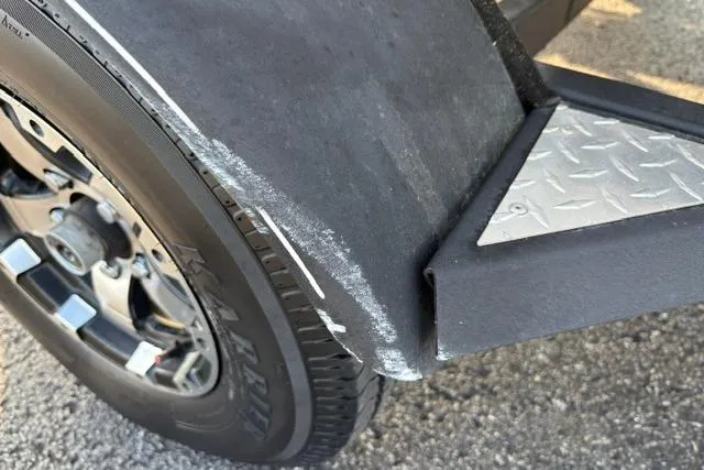 Slide: The Image of Close-up of a 2018 Tracker Pro Team 195 TXW trailer tire and fender. - 54