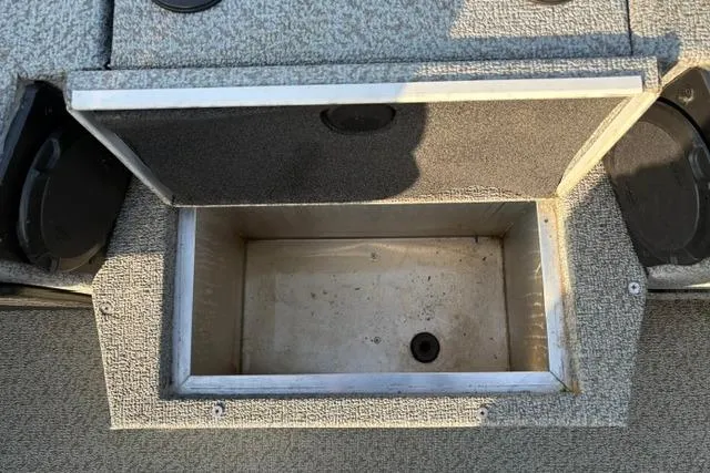 Slide: The Image of Open storage compartment on 2018 Tracker Pro Team 195 TXW boat, 40th Anniversary Edition. - 43