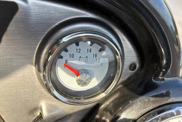 Slide: The Image of Close-up of a 2018 Tracker Pro Team 195 TXW gauge, showing battery voltage. - 28