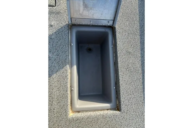 Slide: The Image of Open storage compartment in 2018 Tracker Pro Team 195 TXW boat. - 30