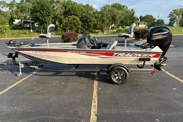 Slide: The Image of 2018 Tracker Pro Team 195 TXW boat in parking lot, side view. - 4