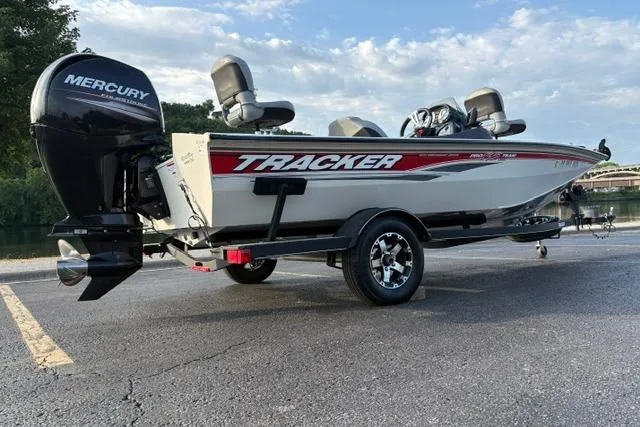 Slide: The Image of 2018 Tracker Pro Team 195 TXW 40th Anniversary Edition boat with Mercury engine on trailer. - 14