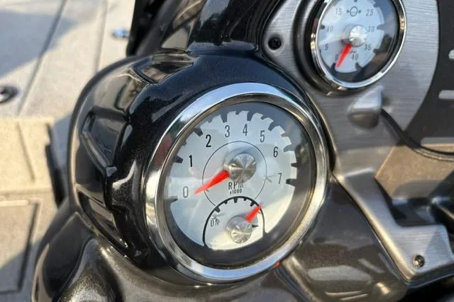Slide: The Image of Close-up of 2018 Tracker Pro Team 195 TXW boat gauges, highlighting RPM and trim indicators. - 37