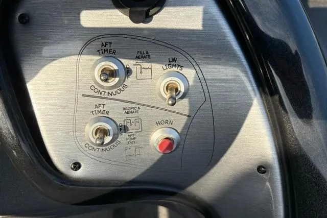 Slide: The Image of Control panel of 2018 Tracker Pro Team 195 TXW boat with switches and buttons. - 39
