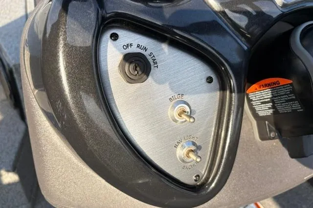 Slide: The Image of Control panel of 2018 Tracker Pro Team 195 TXW boat with ignition and switches. - 34
