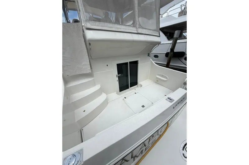 Slide: The Image of Carver 41 Cockpit Motor Yacht 2012, featuring spacious deck and sleek design. - 11