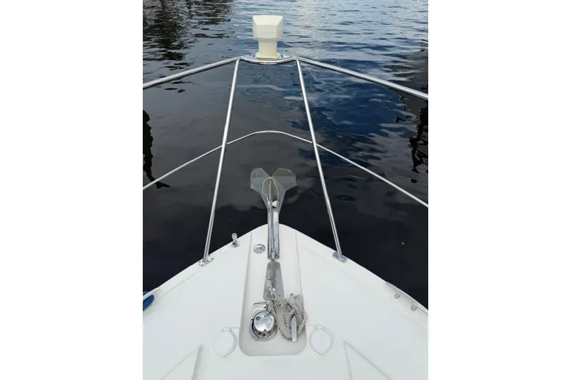 Slide: The Image of Bow view of 2012 Carver 41 Cockpit Motor Yacht on calm water. - 9