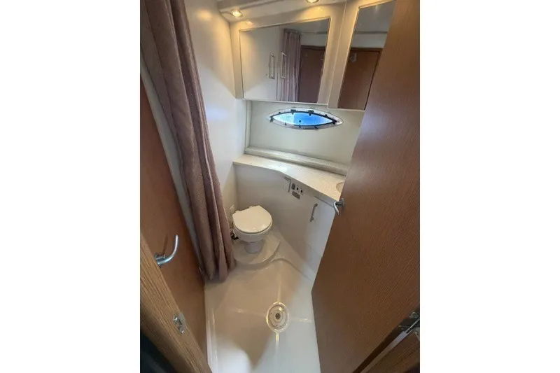 Slide: The Image of Bathroom interior of 2012 Carver 41 Cockpit Motor Yacht with porthole window. - 18