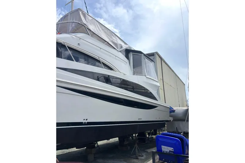 Slide: The Image of Carver 41 Cockpit Motor Yacht 2012 on dry dock, covered and maintained. - 1