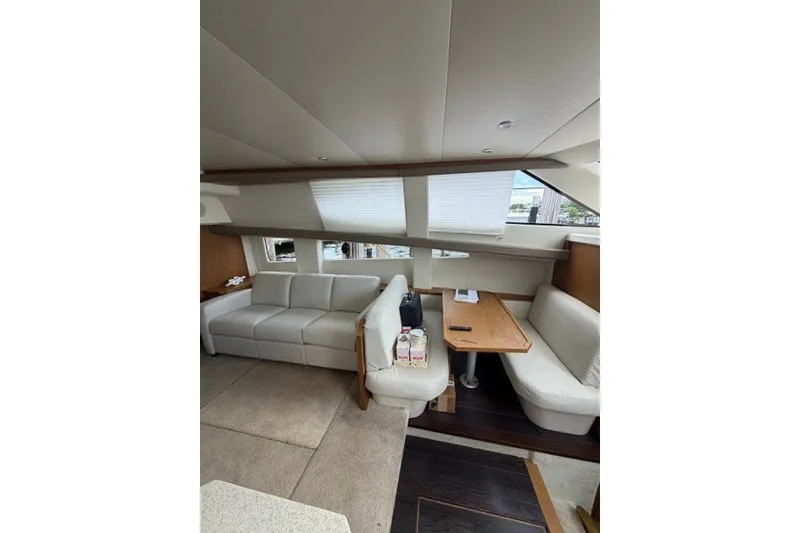 Slide: The Image of Luxurious interior of 2012 Carver 41 Cockpit Motor Yacht with plush seating and dining area. - 35