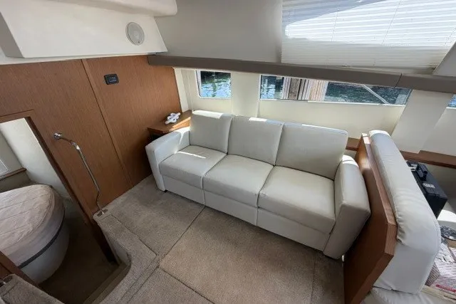 Slide: The Image of Luxurious interior of 2012 Carver 41 Cockpit Motor Yacht with white sofa and modern design. - 13