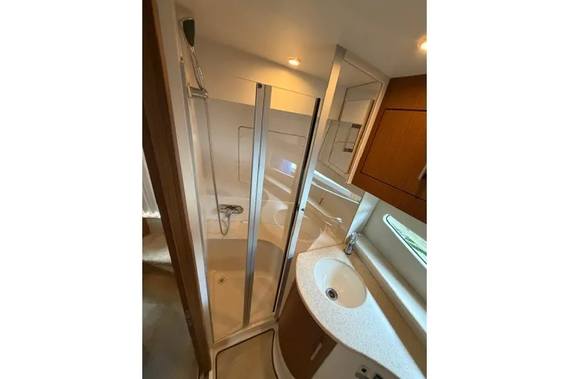 Slide: The Image of Luxurious bathroom in 2012 Carver 41 Cockpit Motor Yacht with shower and sink. - 30