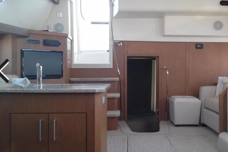Slide: The Image of Interior of 2012 Carver 41 Cockpit Motor Yacht with modern furnishings and compact design. - 6