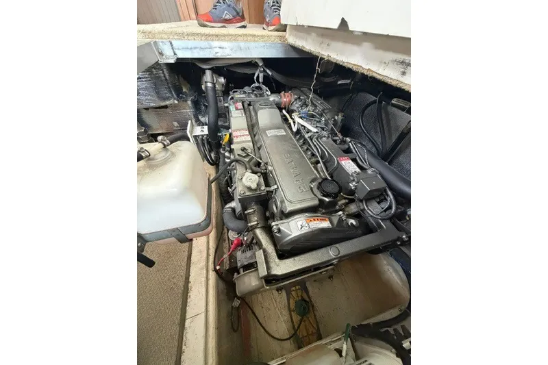 Slide: The Image of Engine compartment of a 2012 Carver 41 Cockpit Motor Yacht, showcasing detailed machinery. - 42
