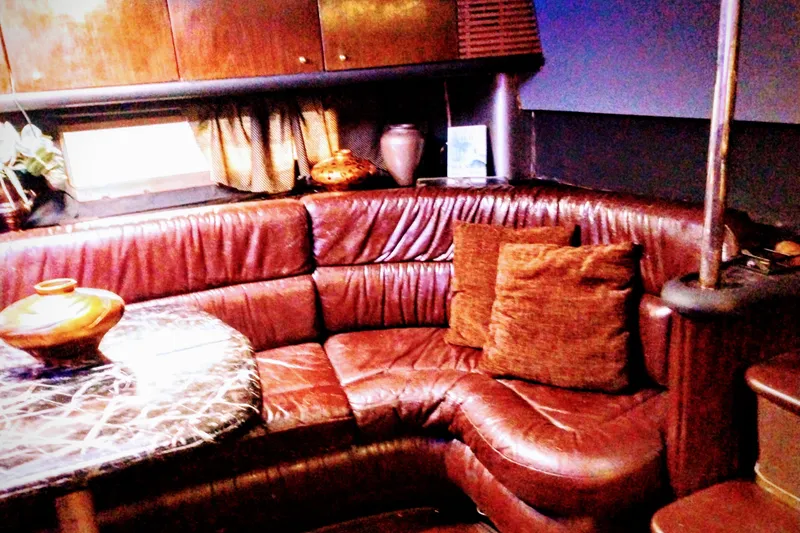Slide: The Image of Luxurious leather seating in a 2000 Sunseeker Camargue 50 yacht interior. - 12