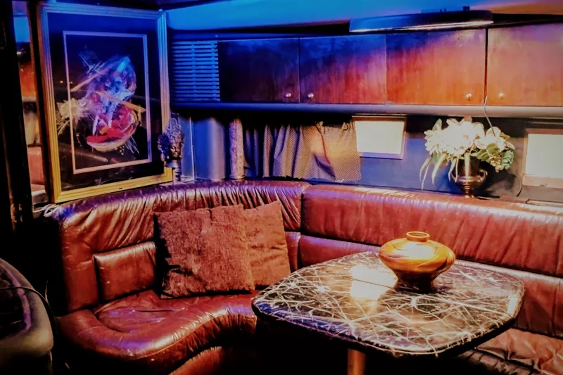 Slide: The Image of Luxurious interior of a 2000 Sunseeker Camargue 50 yacht with leather seating and elegant decor. - 31