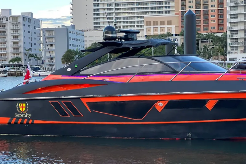 Slide: The Image of Luxury Sunseeker Camargue 50 yacht, 2000 model, docked in urban marina setting. - 1