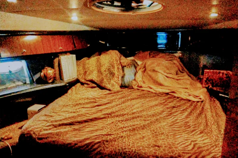 Slide: The Image of Cozy cabin interior of 2000 Sunseeker Camargue 50 yacht with plush bedding. - 14