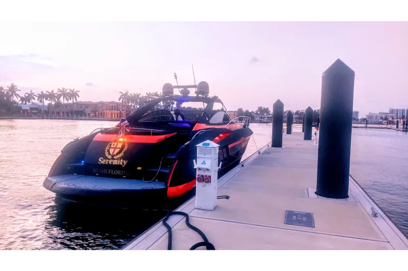 Slide: The Image of Sunseeker Camargue 50 yacht docked at sunset in Miami, Florida, 2000 model. - 7