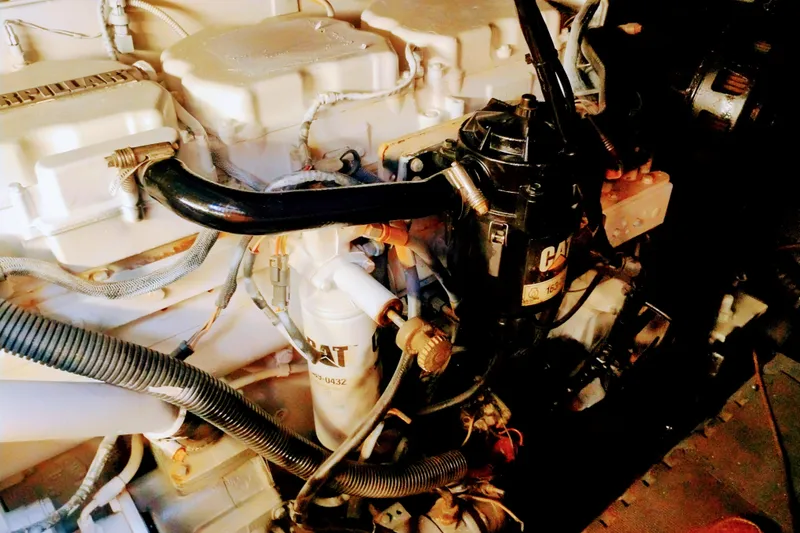 Slide: The Image of Engine compartment of a 2000 Sunseeker Camargue 50 yacht, featuring CAT components. - 20