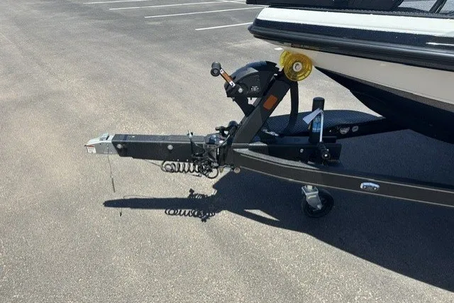 Slide: The Image of Trailer hitch of a 2026 Ranger Z521R boat in a parking lot. - 24
