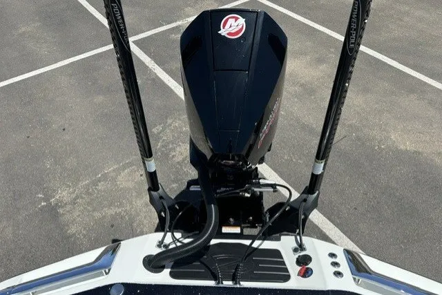 Slide: The Image of 2026 Ranger Z521R boat engine and power poles in a parking lot. - 20