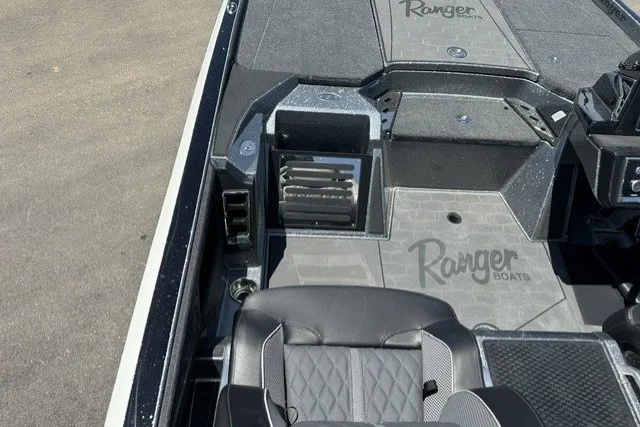 Slide: The Image of 2026 Ranger Z521R boat interior with sleek seating and branded flooring design. - 16