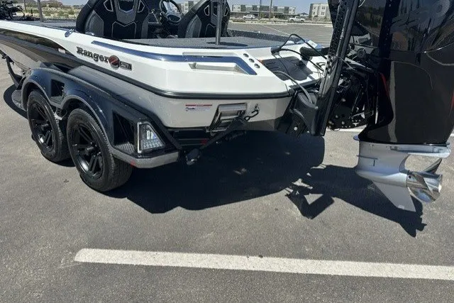 Slide: The Image of 2026 Ranger Z521R boat on trailer, showcasing sleek design and dual axles. - 3