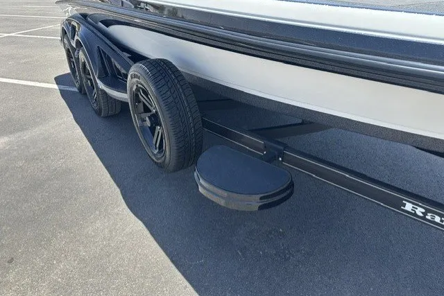 Slide: The Image of 2026 Ranger Z521R boat trailer with black wheels and step, parked on asphalt. - 22