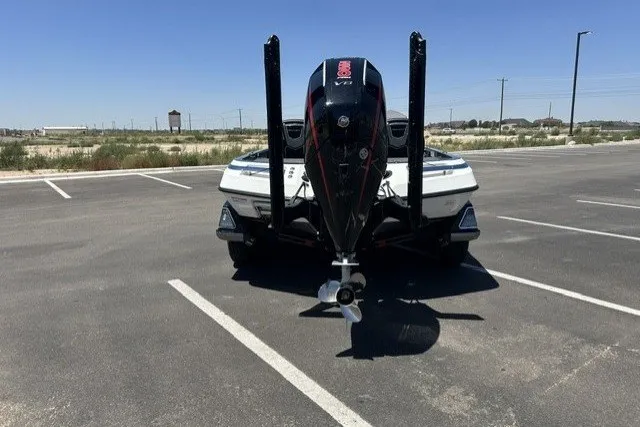 Slide: The Image of 2026 Ranger Z521R boat in parking lot, rear view with powerful outboard motor. - 4