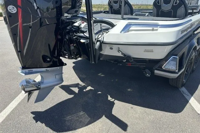 Slide: The Image of 2026 Ranger Z521R boat rear view with powerful outboard motor in parking lot. - 6